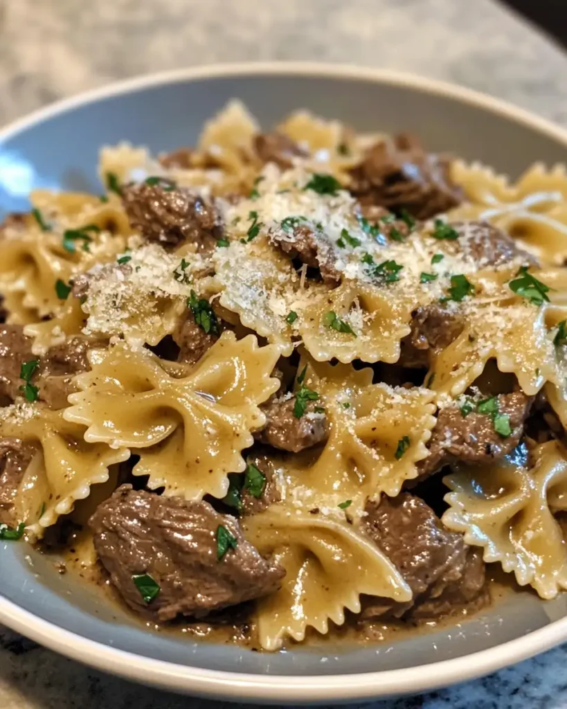 Indulge in Creamy Parmesan Garlic Beef Bowtie Pasta for a Flavorful Feast - Featured Image